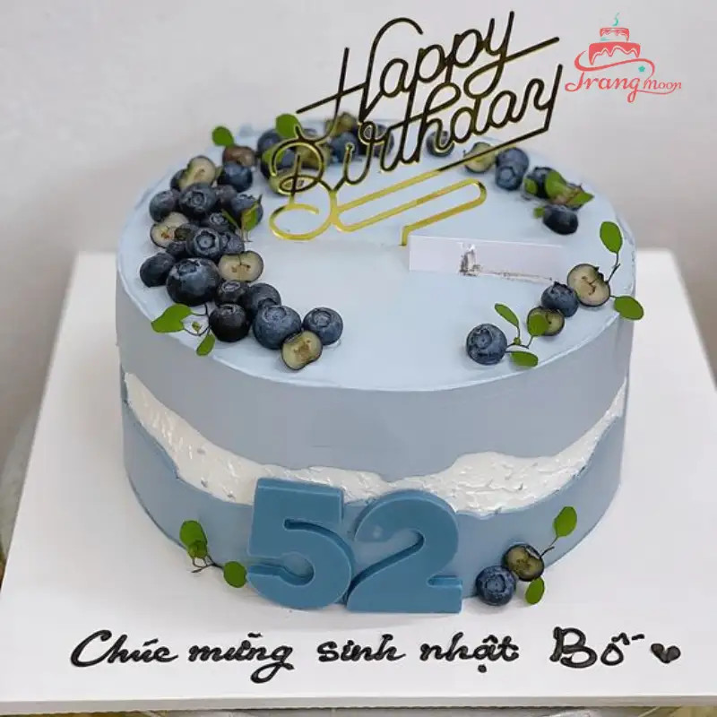 bánh kem xanh dương với topping trái cây tươi mọng
