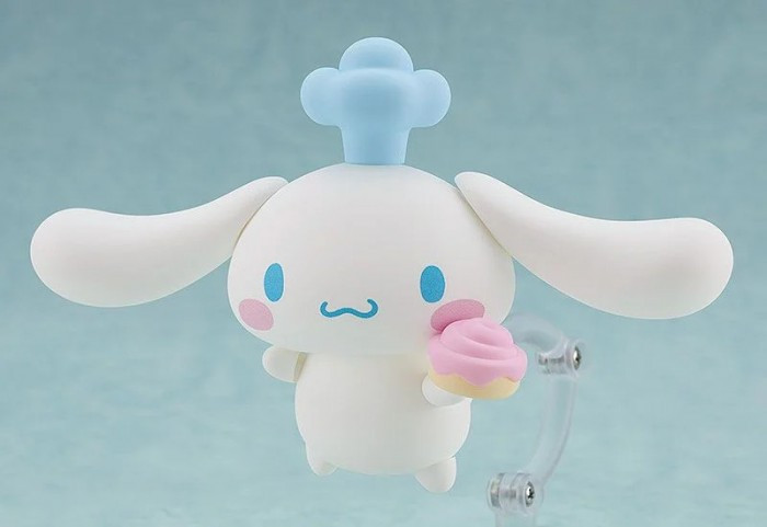 Chú chó Cinnamoroll với đôi tai dài màu xanh nhẹ nhàng trên nền trắng
