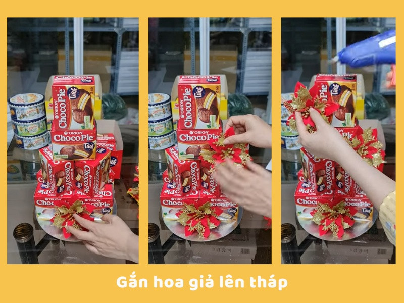 Hình ảnh trang trí tháp bánh Chocopie với hoa giả màu đỏ rực rỡ và phụ kiện Tết.