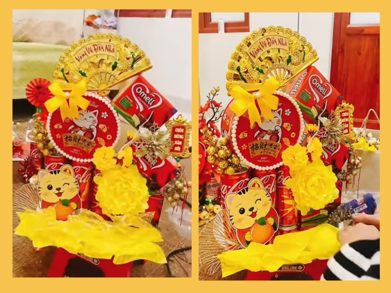 Mẫu tháp bánh kẹo Tết kết hợp hài hòa giữa hộp bánh và các lon nước ngọt.