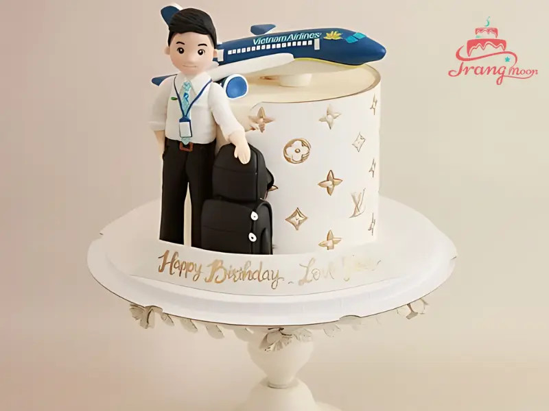 Bánh sinh nhật máy bay và phi công với đồng phục trang trọng